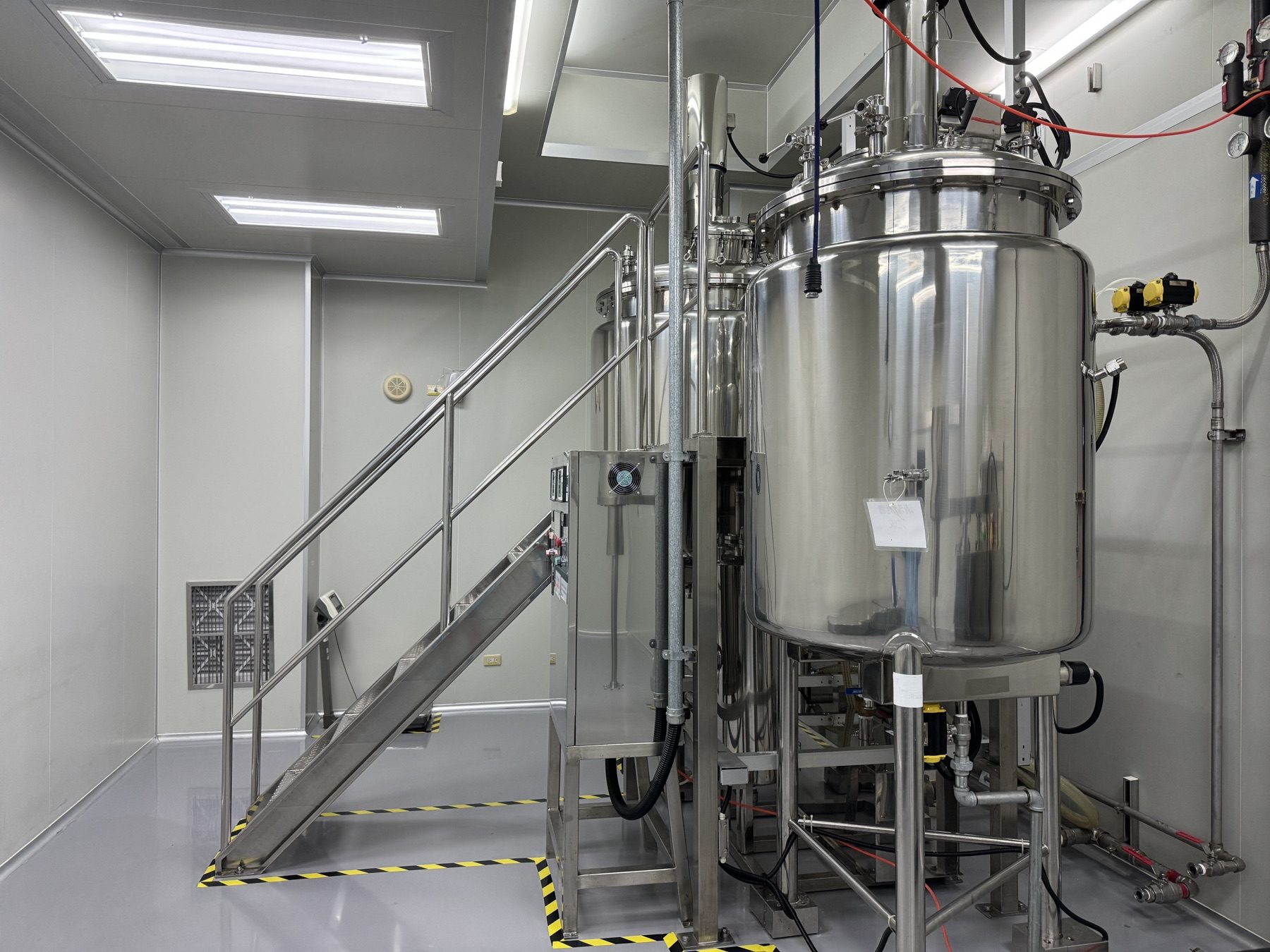 Stainless-steel mixing equipment in Visgeneer’s clean production area
